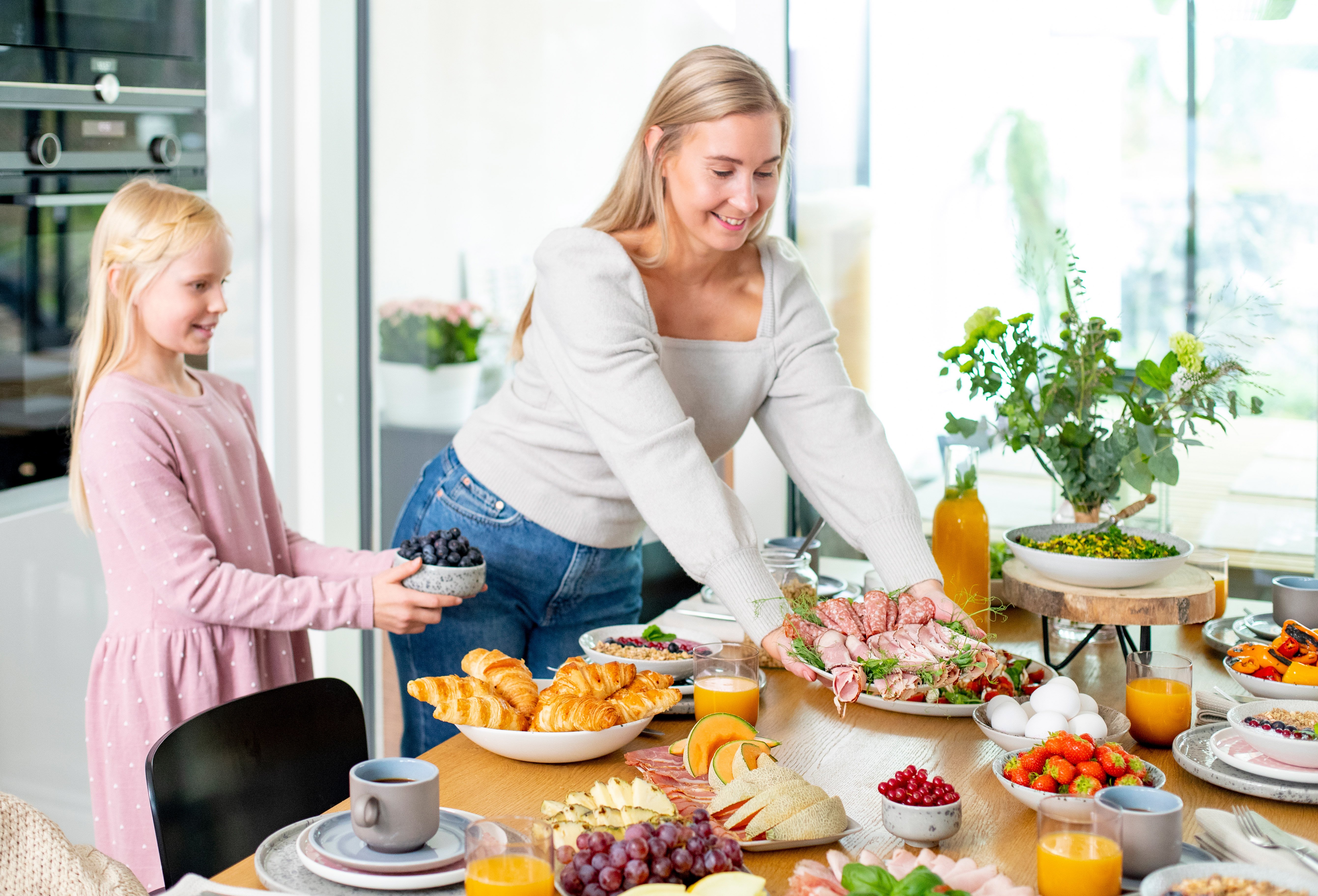 Mother and daughter are preparing brunch